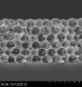 This cross-section micrographs of a tungsten thermal emitter used in the experiment. Figure 2a shows how unprotected tungsten degrades after heating to 1200 degrees Celsius. Fig. 2b demonstrates how the ceramic-coated tungsten retained structural integrity after being subjected to 1400 C heat for an hour.