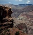 A figure stands on Esplanade surface opposite Vulcan's Throne volcano, Grand Canyon, USA. Photo by J.W. Sears.