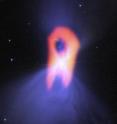 The Boomerang Nebula, called the "coldest place in the Universe," reveals its true shape with ALMA. The background blue structure, as seen in visible light with the Hubble Space Telescope, shows a classic double-lobe shape with a very narrow central region. ALMA's resolution and ability to see the cold molecular gas reveals the nebula's more elongated shape, as seen in red.