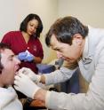 Jason Disanto receives a tongue piercing so he can test the Tongue Drive System.