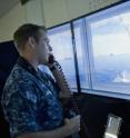 Lt. j.g. Bret Andrews, assigned to the guided-missile destroyer USS Paul Hamilton (DDG 60), stands officer of the deck watch in the Office of Naval Research Fleet Integrated Synthetic Training and Testing Facility (FIST2FAC) operated by the Naval Undersea Warfare Center Division Keyport, located on Ford Island, Hawaii. FIST2FAC allows Sailors to interact with artificially intelligent synthetic forces in verious settings.
