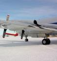 A MCoRDS's underwing radar antenna arrays mounted beneath the wing of NASA's P-3 aircraft at McMurdo Station's airfield is shown. MCoRDS uses arrays beneath the wings and fuselage of the plane, giving a total of 15 antennas that can send and receive signals used to map polar ice and bedrock.