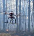 University of Cincinnati student Wei Wei controls an unmanned aerial vehicle during a test burn.