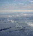 This is an aerial photo of sea ice leads and the clouds generated directly above a sea ice lead due to the large temperature differences between the water and air near Barrow, Alaska.