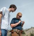 OSU researchers Tyler Lomax and Alison Koleszar examine volcanic rock on Mount Hood.
