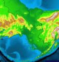 This map shows the outlines of modern Siberia (left) and Alaska (right) with dashed lines. The broader area in darker green (now covered by ocean) represents the Bering land bridge near the end of the last glacial maximum, a period that lasted from 28,000 to 18,000 years ago when sea levels were low and ice sheets extended south into what is now the northern part of the lower 48 states. University of Utah anthropologist Dennis O'Rourke argues in the Feb. 28 issue of the journal <i>Science</i> that the ancestors of Native Americans migrated from Asia onto the Bering land bridge or "Beringia" some 25,000 years ago and spent 10,000 years there until they began moving into the Americas 15,000 years ago as the ice sheets melted.