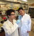 UC Davis graduate student Gabriel Rodriguez, left, and Shota Atsumi, assistant professor of chemistry sample a culture of <i>E. coli</i> engineered to produce a sweet-smelling ester. Esters are key to the $20 billion-a-year scents and flavorings industry, but almost all are currently derived from oil and gas. New technology invented at UC Davis allows specific esters to be made by microbes.