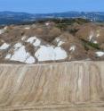 This is the region known as "Crete Senesi" between Florence and Grosseto. The small hills are typically characterized by erosion.