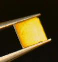 This image shows the first thin films of spin ice. The orange coloration is a spin ice film of only a few billionths of a meter thickness.