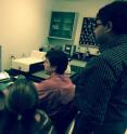 Assistant professor Chanda works with students in his lab at the UCF NanoScience Technology Center.