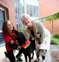 From left: Delta Therapy Dog handler and University of Adelaide Masters in Health Psychology student Marie Dow, with her dog Nilfisk, who regularly visits the Queen Elizabeth Hospital in Adelaide as part of the Delta Therapy Dog program, and the University's Head of the School of Psychology, Professor Anna Chur-Hansen.