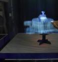This image shows MisTable: reach-through personal screens for tabletops.