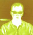 A thermal image of University of Arizona researcher Jared Griebel taken through a piece of new sulfur-based plastic using an infrared camera. Courtesy of Eustace L. Dereniak, University of Arizona College of Optical Sciences.