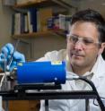 Facundo M. Fernandez, a professor in the School of Chemistry and Biochemistry, examines an emergency contraceptive pill with ambient mass spectrometry.