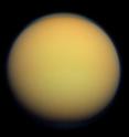 Titan's atmosphere makes Saturn's largest moon look like a fuzzy orange ball in this natural-color view from the Cassini spacecraft. Cassini captured this image in 2012.