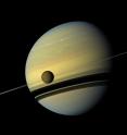 This Cassini image from 2012 shows Titan and its parent planet Saturn.