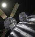 This is a concept image of an astronaut preparing to take samples from a captured asteroid. The sun is in the background; NASA wants to know more about electrical activity generated by the interaction of solar wind and radiation with asteroids.