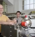 John Eiler (left) and Daniel Stolper (right) with the Caltech-led team's prototype mass spectrometer -- the Thermo IRMS 253 Ultra. This instrument is the first equipped to measure abundances of rare isotopic versions of complex molecules, even where combinations of isotopic substitutions result in closely similar masses. This machine enabled the first precise measurements of molecules of methane that contain two heavy isotopes -- 13CH3D, which incorporates both a carbon-13 atom and a deuterium atom, and 12CH2D2, which includes two deuterium atoms.
