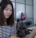 Hae Won Park, a postdoctoral fellow in the School of Electrical and Computing Engineering, teaches a robot how to play Angry Birds.