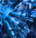 This photo shows Nitin Samarth in his research lab at Penn State working with the molecular beam epitaxy equipment, which provides an ultra-pure environment for his research team's experiments.