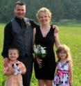 Amy Mills poses for a photo with her husband Jeff and children Joshua and Mikayla. They were at a wedding in Bancroft, Ontario (Canada), in the summer of 2013.