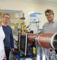 This image depicts from lef to right Dr Martha Clokie, Professor Andy Ellis and Professor Paul Monks from the University of Leicester with the mass spectrometer