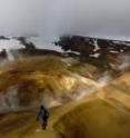 Calvin Miller is shown at the Kerlingarfjoll volcano in central Iceland. Some geologists have proposed that the early Earth may have resembled regions like this.