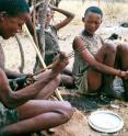 !Kung Kalahari Bushmen in Africa sit in camp. A University of Utah study of nighttime gatherings around fires by these hunter-gatherers suggests that human cultural development was advanced when human ancestors started telling stories around the fire at night to reinforce social traditions, promote harmony and spark the imagination.