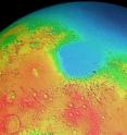 Mars has two differently shaped hemispheres: the lowlands of the northern hemisphere and the volcanic highlands (yellow to red regions) of the southern hemisphere. A "giant impact" on the southern pole is suspected to be the reason for this.