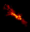This is an ALMA image of starbursting clouds inside NGC 253. The red region is the lower density CO gas surrounding higher density star-forming regions in yellow.