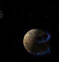 In this artist's concept, the moon Ganymede orbits the giant planet Jupiter. NASA's Hubble Space Telescope observed aurorae on the moon generated by Ganymede's magnetic fields. A saline ocean under the moon's icy crust best explains shifting in the auroral belts measured by Hubble.