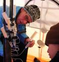 DRI's Alison Murray, Ph.D., and doctoral student Paula Matheus Carnevali collect pore water for geochemical analyses from a thermokarst lake sediment core sampled near Barrow, Alaska.