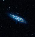 This is a false-color image of the mid-infrared emission from the Great Galaxy in Andromeda, as seen by Nasa's&nbsp;WISE&nbsp;space telescope.  The orange color represents emission from the heat of stars forming in the galaxy's spiral arms. The G-HAT team used images such as these to search 100,000 nearby galaxies for unusually large amounts of this mid-infrared emission that might arise from alien civilizations.