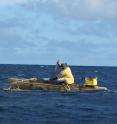 A canoeist paddles between the islands of Vava'u, Tonga. A new University of Utah study uses mathematical modeling to get a better idea of the strategies employed by early seafarers when they used outrigger canoes to settle the islands of the vast Pacific Ocean between 3,500 and 900 years ago.