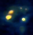 This is an ALMA image of dense cores of molecular gas in the Antennae galaxies. The round yellow object near the center may be the first prenatal example of a globular cluster ever identified. It is surrounded by a giant molecular cloud.