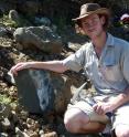 This is Dr. Michael Day with a skull of <i>Anteosaurus</i> found close to the extinction interval on the Nuweveld Escarpment north of Merwevillle, Western Cape Province.