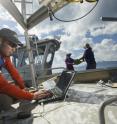 UC Davis Tahoe Environmental Research Center postdoctoral scholar Shohei Watanabe collects data from a UC Davis-NASA research buoy to measure Lake Tahoe's blueness.