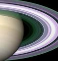In this simulated image of Saturn's rings, color is used to present information about ring particle sizes in different regions based on the measured attenuations of three radio signals.