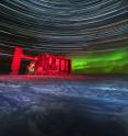This is a a high-energy neutrino event of the northern sky superimposed on a view of the IceCube Lab at the South Pole.