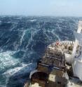 A research vessel plows through the waves, braving the strong westerly winds of the Roaring Forties in the Southern Ocean in order to measure levels of dissolved carbon dioxide in the surface ocean.