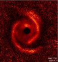 Observations taken by the European Southern Observatory's Very Large Telescope show a protoplanetary disk around the young star MWC 758. The disk has two spiral arms that extend over 10 billion miles from the star.