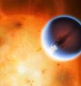 The planet HD 189733b is shown here in front of its parent star. A belt of wind around the equator of the planet travels at 5400mph from the heated day side to the night side. The day side of the planet appears blue due to scattering of light from silicate haze in the atmosphere. The night side of the planet glows a deep red due to its high temperature.