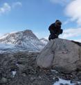 In Baffin Island's Naqsaq Valley, University at Buffalo geologist Jason Briner samples a boulder left by a glacier around the time of early Viking settlement. Measurements of chemical isotopes within the rock suggest settlers in neighboring Greenland faced cold weather.