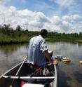 Nick Gubbins, an undergraduate student who has worked in the Stanley lab, takes methane flux measurements in the field.