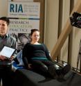 Professor Alexander Wong and Robert Amelard at the Schlegel-University of Waterloo Research Institute for Aging analyze blood-flow data extracted with their new touchless device, pictured right.
