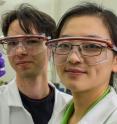 Rice University graduate student Alin Cristian Chipara and postdoctoral researcher Pei Dong show a sample of their self-adaptive composite, which they say shows potential for tissue engineering or lightweight structural applications.