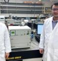 Amin Salehi-Khojin, UIC assistant professor of mechanical and industrial engineering (right), and postdoctoral research associate Mohammad Asadi with their specially modified differential electrochemical mass spectrometry (DEMS) instrument.