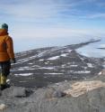 A researcher studies the West Antarctic landscape.