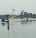 This is a fishermen at work on the Mekong River which is currently threatened by the numerous dams being constructed for production of hydropower.