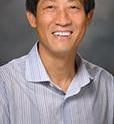 This is a photograph of Dean Tang, M.D., Ph.D.